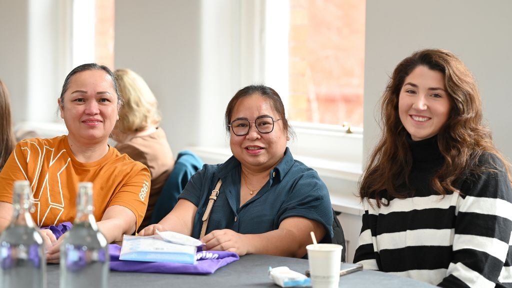 members at gathering listening to speaker